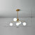 Orb Shaped Hanging Light Postmodern Glass Gold Finish Chandelier for Living Room 5 Cream Clearhalo 'Ceiling Lights' 'Chandeliers' 'Clear' 'Industrial' 'Modern Chandeliers' 'Modern' 'Tiffany' 'Traditional Chandeliers' Lighting' 2269186