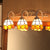 3 Lights Dome Wall Mount Light Stained Glass Tiffany Vanity Lighting in Orange/Blue for Bathroom Orange Clearhalo 'Industrial' 'Middle century wall lights' 'Tiffany wall lights' 'Tiffany' 'Wall Lamps & Sconces' 'Wall Lights' Lighting' 22711