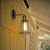 1-Light Swivelable Arm Wall Light Industrial Black Metal Wall Lamp Fixture with Cage Shade Black Clearhalo 'Art deco wall lights' 'Cast Iron' 'Glass' 'Industrial wall lights' 'Industrial' 'Middle century wall lights' 'Modern' 'Rustic wall lights' 'Tiffany' 'Traditional wall lights' 'Wall Lamps & Sconces' 'Wall Lights' Lighting' 2294009