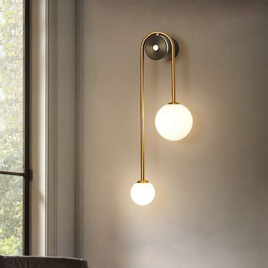 Brass Arc Wall Lighting Postmodern 2-Head Metal Sconce Light with Ball Opal Glass Shade Clearhalo 'Cast Iron' 'Glass' 'Industrial' 'Modern wall lights' 'Modern' 'Tiffany' 'Traditional wall lights' 'Wall Lamps & Sconces' 'Wall Lights' Lighting' 2353449
