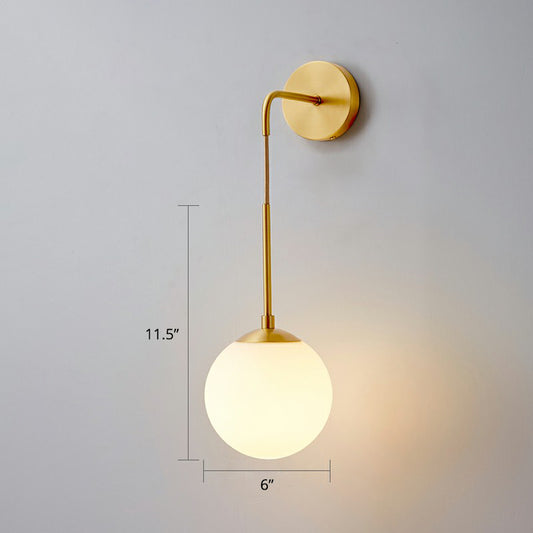 Global Wall Light Fixture Simplicity White Glass 1 Bulb Bedroom Sconce Lamp in Brass Brass 6" Clearhalo 'Cast Iron' 'Glass' 'Industrial' 'Modern wall lights' 'Modern' 'Tiffany' 'Traditional wall lights' 'Wall Lamps & Sconces' 'Wall Lights' Lighting' 2353455