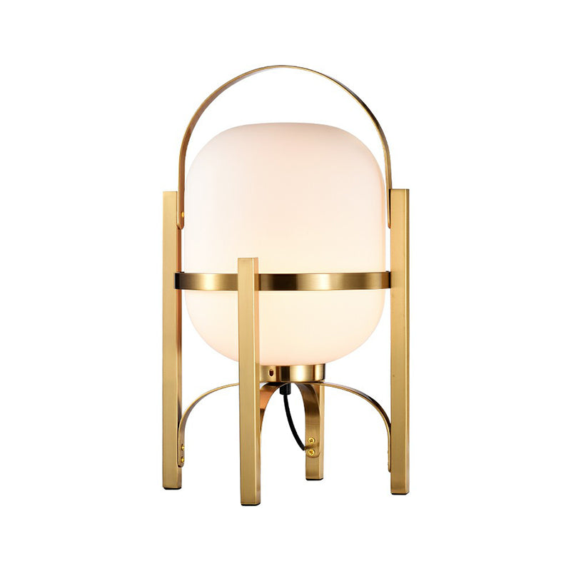 Capsule Glass Night Lamp Postmodern 1-Light Brass Finish Table Light with Quadpod and Arched Handle White Clearhalo 'Lamps' 'Table Lamps' Lighting' 2353527