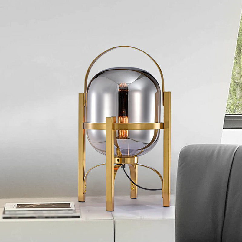 Capsule Glass Night Lamp Postmodern 1-Light Brass Finish Table Light with Quadpod and Arched Handle Clearhalo 'Lamps' 'Table Lamps' Lighting' 2353531
