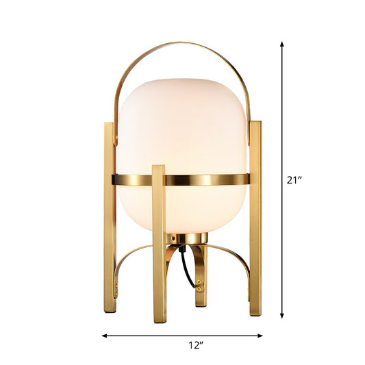 Capsule Glass Night Lamp Postmodern 1-Light Brass Finish Table Light with Quadpod and Arched Handle Clearhalo 'Lamps' 'Table Lamps' Lighting' 2353532