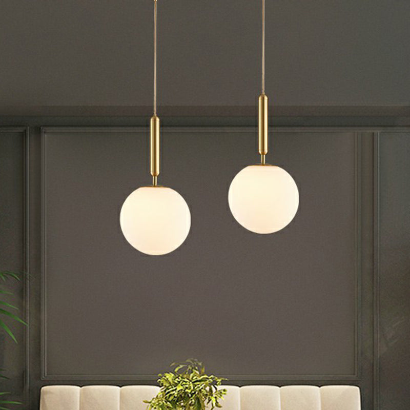 Ball Dining Room Pendulum Light White Glass 1-Head Simple Pendant Lighting in Brass Clearhalo 'Ceiling Lights' 'Modern Pendants' 'Modern' 'Pendant Lights' 'Pendants' Lighting' 2353835