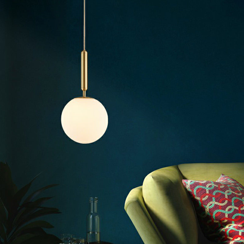Ball Dining Room Pendulum Light White Glass 1-Head Simple Pendant Lighting in Brass Clearhalo 'Ceiling Lights' 'Modern Pendants' 'Modern' 'Pendant Lights' 'Pendants' Lighting' 2353837