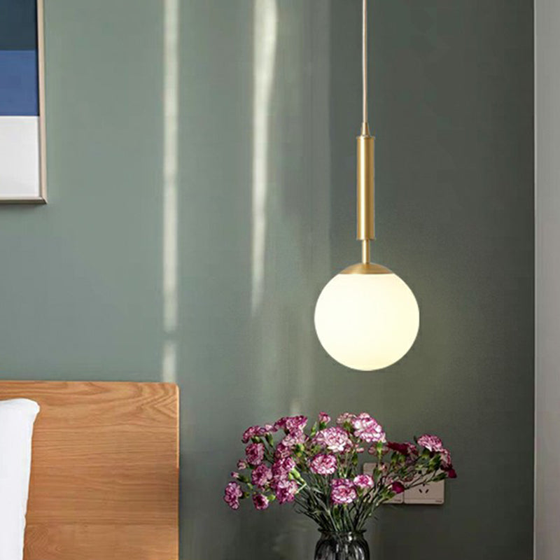 Minimalist Ball Pendant Light Milk Glass 1-Light Dining Room Hanging Lamp in Brass White Clearhalo 'Ceiling Lights' 'Modern Pendants' 'Modern' 'Pendant Lights' 'Pendants' Lighting' 2353840