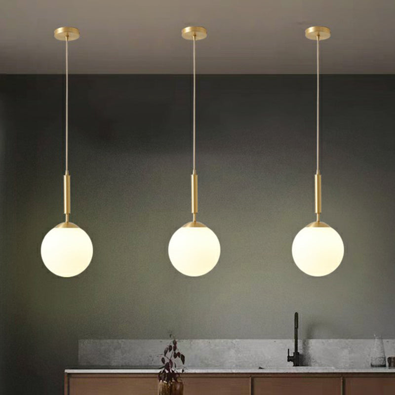 Minimalist Ball Pendant Light Milk Glass 1-Light Dining Room Hanging Lamp in Brass Clearhalo 'Ceiling Lights' 'Modern Pendants' 'Modern' 'Pendant Lights' 'Pendants' Lighting' 2353841