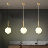 Minimalist Ball Pendant Light Milk Glass 1-Light Dining Room Hanging Lamp in Brass Clearhalo 'Ceiling Lights' 'Modern Pendants' 'Modern' 'Pendant Lights' 'Pendants' Lighting' 2353841