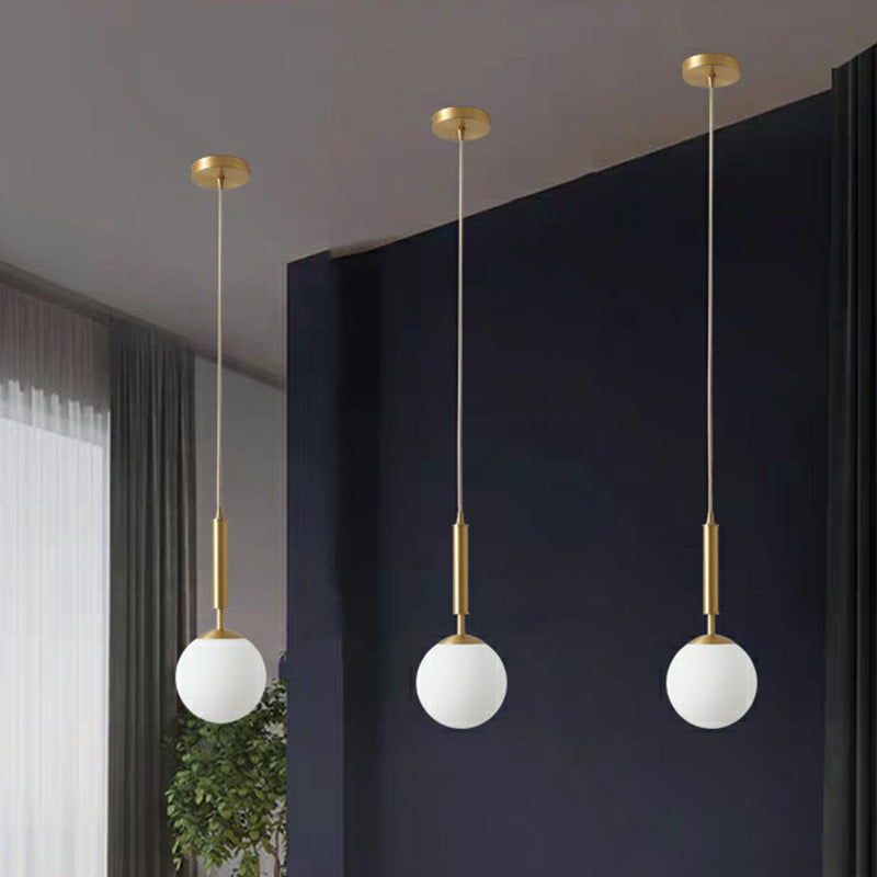 Minimalist Ball Pendant Light Milk Glass 1-Light Dining Room Hanging Lamp in Brass Clearhalo 'Ceiling Lights' 'Modern Pendants' 'Modern' 'Pendant Lights' 'Pendants' Lighting' 2353842