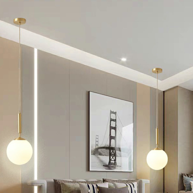 Minimalist Ball Pendant Light Milk Glass 1-Light Dining Room Hanging Lamp in Brass Clearhalo 'Ceiling Lights' 'Modern Pendants' 'Modern' 'Pendant Lights' 'Pendants' Lighting' 2353843