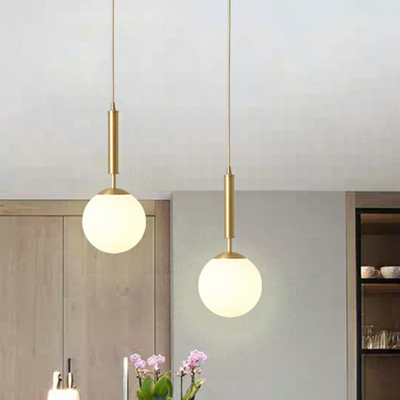 Minimalist Ball Pendant Light Milk Glass 1-Light Dining Room Hanging Lamp in Brass Clearhalo 'Ceiling Lights' 'Modern Pendants' 'Modern' 'Pendant Lights' 'Pendants' Lighting' 2353844