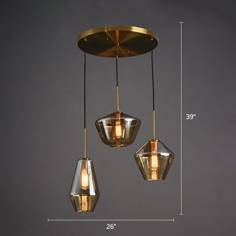 Postmodern 3 Bulbs Cluster Pendant Brass Geometric Ceiling Suspension Light with Glass Shade Amber Round Clearhalo 'Ceiling Lights' 'Modern Pendants' 'Modern' 'Pendant Lights' 'Pendants' Lighting' 2353934