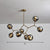Brass Finish Molecular Chandelier Postmodern Metal Hanging Light with Ball Glass Shade 8 Smoke Gray Clearhalo 'Ceiling Lights' 'Chandeliers' 'Clear' 'Industrial' 'Modern Chandeliers' 'Modern' 'Tiffany' 'Traditional Chandeliers' Lighting' 2354041