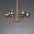 Post-Modern Ball Up Chandelier Glass Dining Room Suspension Light Fixture in Brass 6 Smoke Gray Clearhalo 'Ceiling Lights' 'Chandeliers' 'Clear' 'Industrial' 'Modern Chandeliers' 'Modern' 'Tiffany' 'Traditional Chandeliers' Lighting' 2354077