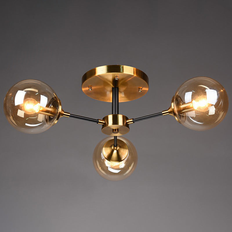 Black and Brass Radial Flush Mount Lighting Postmodern Metal Semi Flush Ceiling Light with Ball Glass Shade 3 Amber Clearhalo 'Ceiling Lights' 'Close To Ceiling Lights' 'Close to ceiling' 'Semi-flushmount' Lighting' 2354115