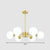 Cream Glass Spherical Chandelier Light Minimalist Brass Ceiling Hang Lamp for Living Room 6 Brass Clearhalo 'Ceiling Lights' 'Chandeliers' 'Modern Chandeliers' 'Modern' Lighting' 2354251