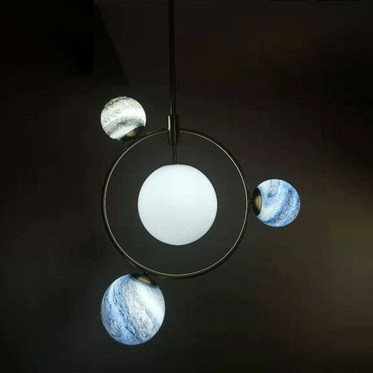 Nordic Planet Chandelier White-Stained Glass Restaurant Hanging Light Fixture in Brass 4 White Clearhalo 'Ceiling Lights' 'Chandeliers' 'Modern Chandeliers' 'Modern' Lighting' 2354342
