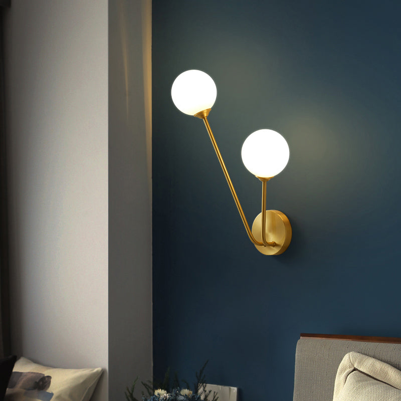 Brass Branch Wall Light Minimalistic Ball Glass Sconce Lighting Fixture for Bedroom Cream 14" Clearhalo 'Cast Iron' 'Glass' 'Industrial' 'Modern wall lights' 'Modern' 'Tiffany' 'Traditional wall lights' 'Wall Lamps & Sconces' 'Wall Lights' Lighting' 2356697