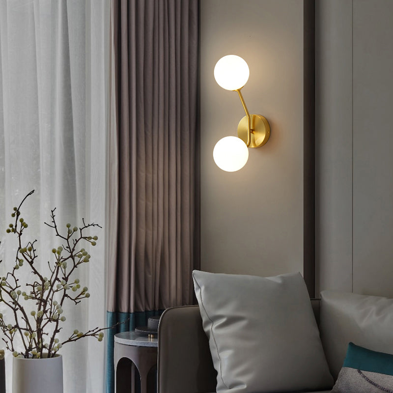 Brass Branch Wall Light Minimalistic Ball Glass Sconce Lighting Fixture for Bedroom Cream 4" Clearhalo 'Cast Iron' 'Glass' 'Industrial' 'Modern wall lights' 'Modern' 'Tiffany' 'Traditional wall lights' 'Wall Lamps & Sconces' 'Wall Lights' Lighting' 2356700
