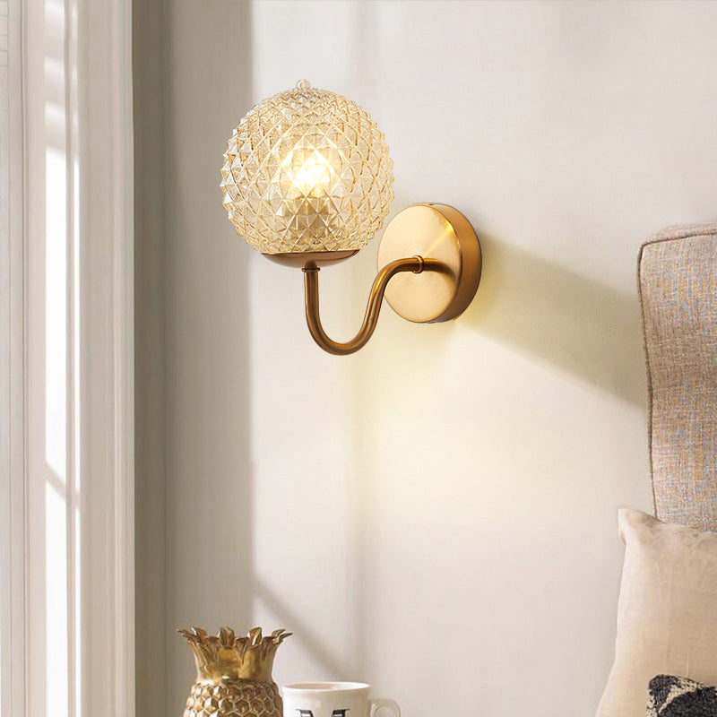 Postmodern Ball Shaped Sconce Lamp Textured Glass 1-Bulb Bedside Wall Light in Brass Clearhalo 'Cast Iron' 'Glass' 'Industrial' 'Modern wall lights' 'Modern' 'Tiffany' 'Traditional wall lights' 'Wall Lamps & Sconces' 'Wall Lights' Lighting' 2356713
