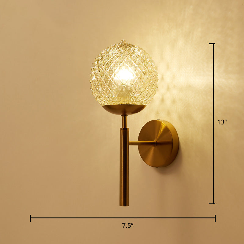 Postmodern Ball Shaped Sconce Lamp Textured Glass 1-Bulb Bedside Wall Light in Brass Brass Globe Straight Clearhalo 'Cast Iron' 'Glass' 'Industrial' 'Modern wall lights' 'Modern' 'Tiffany' 'Traditional wall lights' 'Wall Lamps & Sconces' 'Wall Lights' Lighting' 2356718