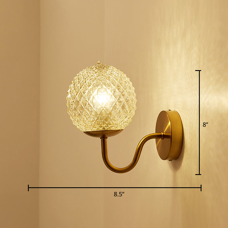 Postmodern Ball Shaped Sconce Lamp Textured Glass 1-Bulb Bedside Wall Light in Brass Brass Globe Curved Clearhalo 'Cast Iron' 'Glass' 'Industrial' 'Modern wall lights' 'Modern' 'Tiffany' 'Traditional wall lights' 'Wall Lamps & Sconces' 'Wall Lights' Lighting' 2356719
