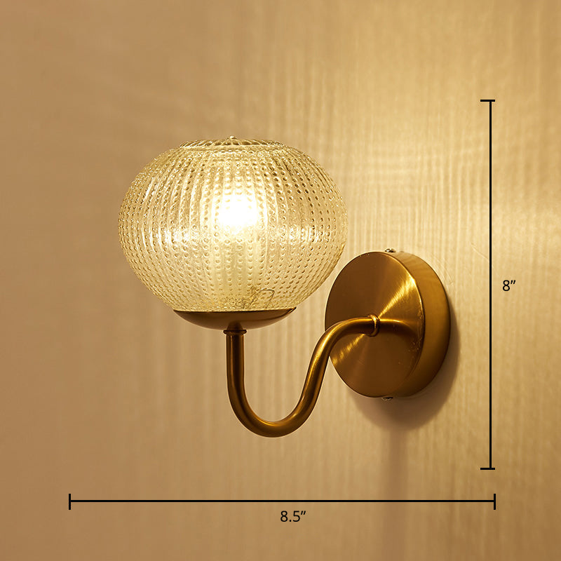 Postmodern Ball Shaped Sconce Lamp Textured Glass 1-Bulb Bedside Wall Light in Brass Brass Tapered Curved Clearhalo 'Cast Iron' 'Glass' 'Industrial' 'Modern wall lights' 'Modern' 'Tiffany' 'Traditional wall lights' 'Wall Lamps & Sconces' 'Wall Lights' Lighting' 2356720
