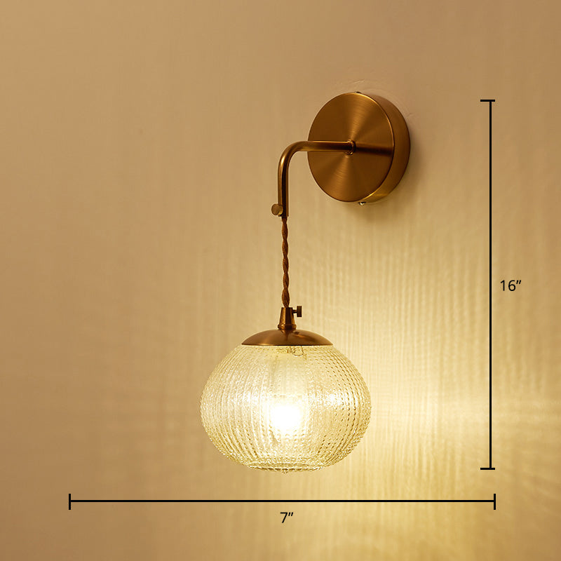 Postmodern Ball Shaped Sconce Lamp Textured Glass 1-Bulb Bedside Wall Light in Brass Brass Tapered Arc Clearhalo 'Cast Iron' 'Glass' 'Industrial' 'Modern wall lights' 'Modern' 'Tiffany' 'Traditional wall lights' 'Wall Lamps & Sconces' 'Wall Lights' Lighting' 2356723