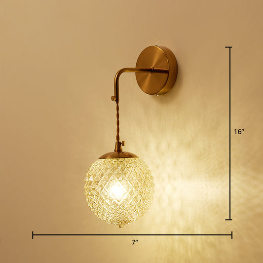 Postmodern Ball Shaped Sconce Lamp Textured Glass 1-Bulb Bedside Wall Light in Brass Brass Globe Arc Clearhalo 'Cast Iron' 'Glass' 'Industrial' 'Modern wall lights' 'Modern' 'Tiffany' 'Traditional wall lights' 'Wall Lamps & Sconces' 'Wall Lights' Lighting' 2356724