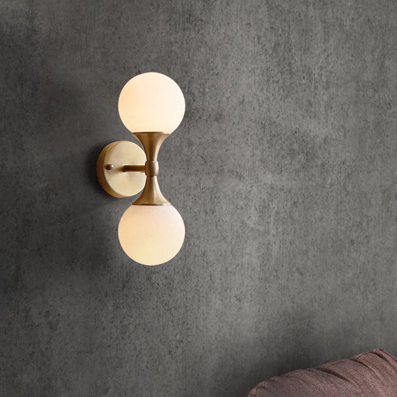 Simple Style Ball Wall Lamp Ivory Glass 2-Head Bedroom Wall Sconce Light in Brass Clearhalo 'Cast Iron' 'Glass' 'Industrial' 'Modern wall lights' 'Modern' 'Tiffany' 'Traditional wall lights' 'Wall Lamps & Sconces' 'Wall Lights' Lighting' 2356745