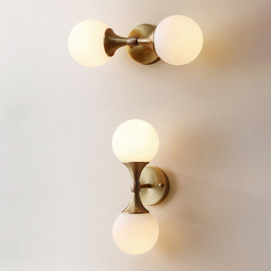 Simple Style Ball Wall Lamp Ivory Glass 2-Head Bedroom Wall Sconce Light in Brass Clearhalo 'Cast Iron' 'Glass' 'Industrial' 'Modern wall lights' 'Modern' 'Tiffany' 'Traditional wall lights' 'Wall Lamps & Sconces' 'Wall Lights' Lighting' 2356746