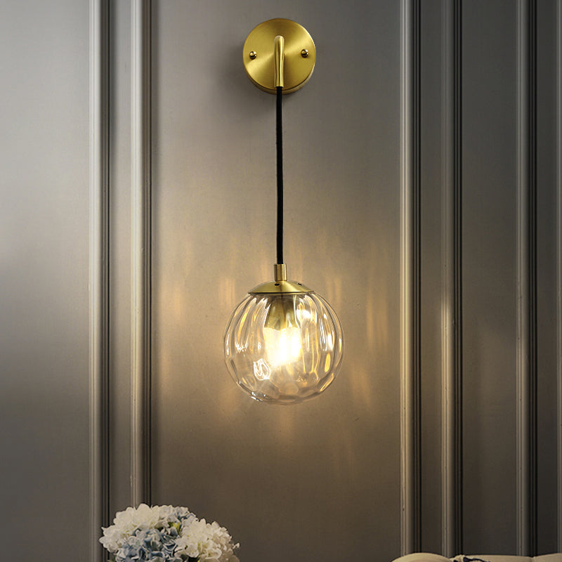 Clear Ripple Glass Ball Wall Light Minimalistic 1-Light Brass Sconce Fixture for Dining Room Clearhalo 'Cast Iron' 'Glass' 'Industrial' 'Modern wall lights' 'Modern' 'Tiffany' 'Traditional wall lights' 'Wall Lamps & Sconces' 'Wall Lights' Lighting' 2356777