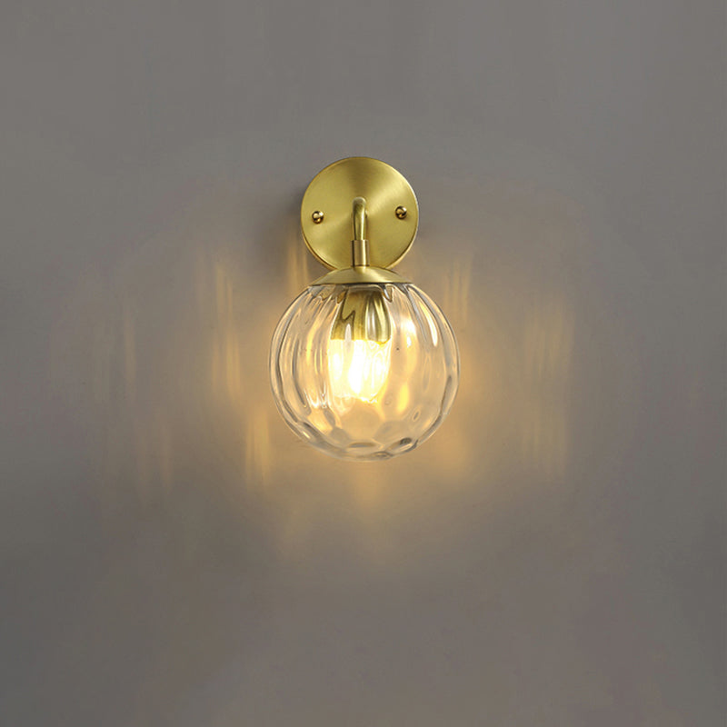 Clear Ripple Glass Ball Wall Light Minimalistic 1-Light Brass Sconce Fixture for Dining Room Brass Short Arm Clearhalo 'Cast Iron' 'Glass' 'Industrial' 'Modern wall lights' 'Modern' 'Tiffany' 'Traditional wall lights' 'Wall Lamps & Sconces' 'Wall Lights' Lighting' 2356779