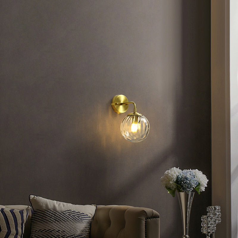 Clear Ripple Glass Ball Wall Light Minimalistic 1-Light Brass Sconce Fixture for Dining Room Clearhalo 'Cast Iron' 'Glass' 'Industrial' 'Modern wall lights' 'Modern' 'Tiffany' 'Traditional wall lights' 'Wall Lamps & Sconces' 'Wall Lights' Lighting' 2356781