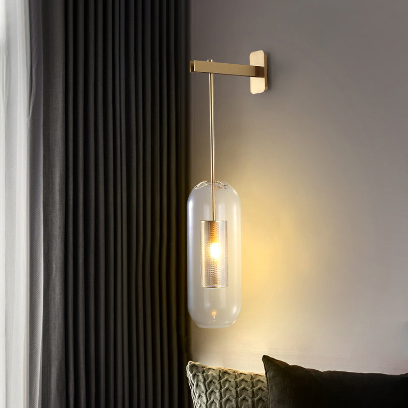 Pill Capsule Glass Wall Lamp Post-Modern 1 Head Brass Sconce Light Fixture with Mesh Guard Clearhalo 'Cast Iron' 'Glass' 'Industrial' 'Modern wall lights' 'Modern' 'Tiffany' 'Traditional wall lights' 'Wall Lamps & Sconces' 'Wall Lights' Lighting' 2356795