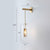 Pill Capsule Glass Wall Lamp Post-Modern 1 Head Brass Sconce Light Fixture with Mesh Guard Clear Short Arm Clearhalo 'Cast Iron' 'Glass' 'Industrial' 'Modern wall lights' 'Modern' 'Tiffany' 'Traditional wall lights' 'Wall Lamps & Sconces' 'Wall Lights' Lighting' 2356796