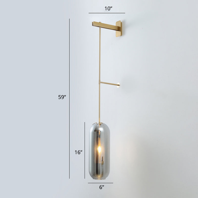 Pill Capsule Glass Wall Lamp Post-Modern 1 Head Brass Sconce Light Fixture with Mesh Guard Smoke Gray Long Arm Clearhalo 'Cast Iron' 'Glass' 'Industrial' 'Modern wall lights' 'Modern' 'Tiffany' 'Traditional wall lights' 'Wall Lamps & Sconces' 'Wall Lights' Lighting' 2356804
