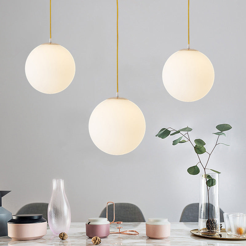 Globe Milky Glass Hanging Lamp Minimalistic 1-Light Gold Pendant Light for Dining Room Clearhalo 'Ceiling Lights' 'Modern Pendants' 'Modern' 'Pendant Lights' 'Pendants' Lighting' 2356905