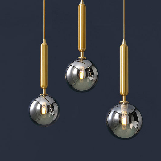 3 Lights Dining Room Multi Ceiling Light Postmodern Brass Pendant with Ball Glass Shade Smoke Gray 12" Clearhalo 'Ceiling Lights' 'Modern Pendants' 'Modern' 'Pendant Lights' 'Pendants' Lighting' 2357034