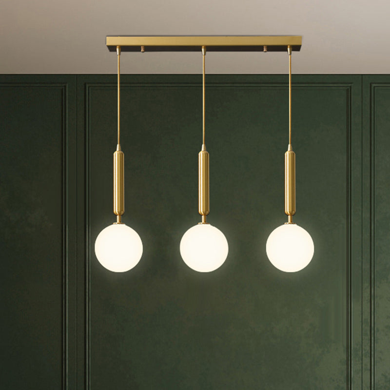 3 Lights Dining Room Multi Ceiling Light Postmodern Brass Pendant with Ball Glass Shade Clearhalo 'Ceiling Lights' 'Modern Pendants' 'Modern' 'Pendant Lights' 'Pendants' Lighting' 2357038