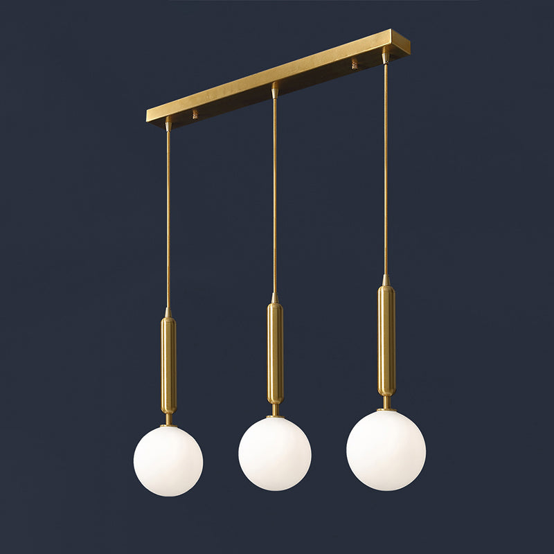 3 Lights Dining Room Multi Ceiling Light Postmodern Brass Pendant with Ball Glass Shade Clearhalo 'Ceiling Lights' 'Modern Pendants' 'Modern' 'Pendant Lights' 'Pendants' Lighting' 2357040