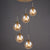 Brass Finish Cluster Ball Pendant Post-Modern 5 Bulbs Glass Suspended Lighting Fixture Amber Globe Clearhalo 'Ceiling Lights' 'Modern Pendants' 'Modern' 'Pendant Lights' 'Pendants' Lighting' 2384747