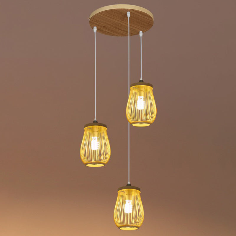 Bamboo Cage Suspension Light Asian Beige Multiple Hanging Pendant Light for Stairway 3 Beige Oval Clearhalo 'Ceiling Lights' 'Modern Pendants' 'Modern' 'Pendant Lights' 'Pendants' Lighting' 2385175