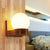 Ball Shaped Foyer Wall Sconce Opal Glass 1-Light Nordic Wall Light Fixture in Wood Wood Clearhalo 'Modern wall lights' 'Modern' 'Wall Lamps & Sconces' 'Wall Lights' Lighting' 2389779