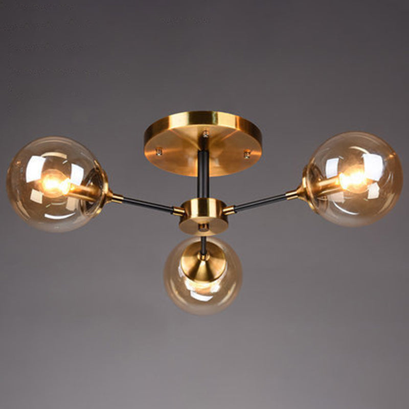 Brass Finish Radial Ceiling Lamp Postmodern Metal Semi Mount Lighting with Ball Glass Shade 3 Amber Clearhalo 'Ceiling Lights' 'Close To Ceiling Lights' 'Close to ceiling' 'Semi-flushmount' Lighting' 2408718