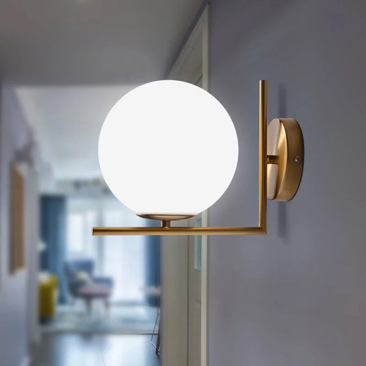 Minimalist Ball Wall Lamp Opaline Glass 1 Bulb Aisle Sconce Light with Right Angle Arm in Brass Clearhalo 'Cast Iron' 'Glass' 'Industrial' 'Modern wall lights' 'Modern' 'Tiffany' 'Traditional wall lights' 'Wall Lamps & Sconces' 'Wall Lights' Lighting' 2408760