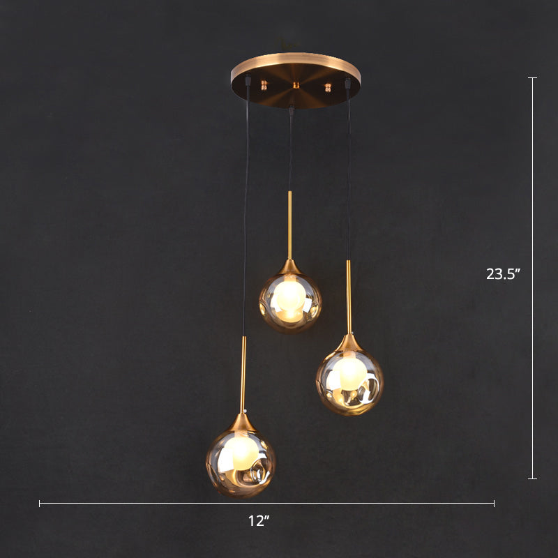Ball Down Lighting Pendant Minimalism Glass 3-Head Dining Room Multiple Hanging Light Amber Round Clearhalo 'Ceiling Lights' 'Modern Pendants' 'Modern' 'Pendant Lights' 'Pendants' Lighting' 2408789