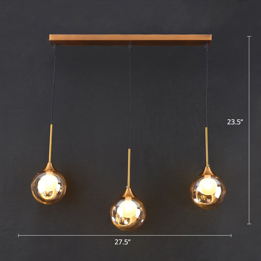 Ball Down Lighting Pendant Minimalism Glass 3-Head Dining Room Multiple Hanging Light Amber Linear Clearhalo 'Ceiling Lights' 'Modern Pendants' 'Modern' 'Pendant Lights' 'Pendants' Lighting' 2408790
