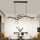 Metal Wavy Island Pendant Minimalist 4-Light Black Hanging Lamp with Ball Glass Shade and Bird Deco Clearhalo 'Ceiling Lights' 'Island Lights' Lighting' 2408800